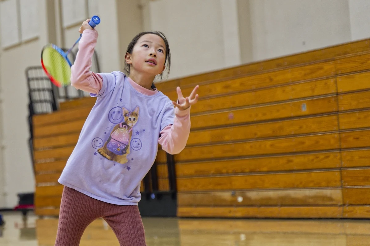 Young player preparing to return a shot